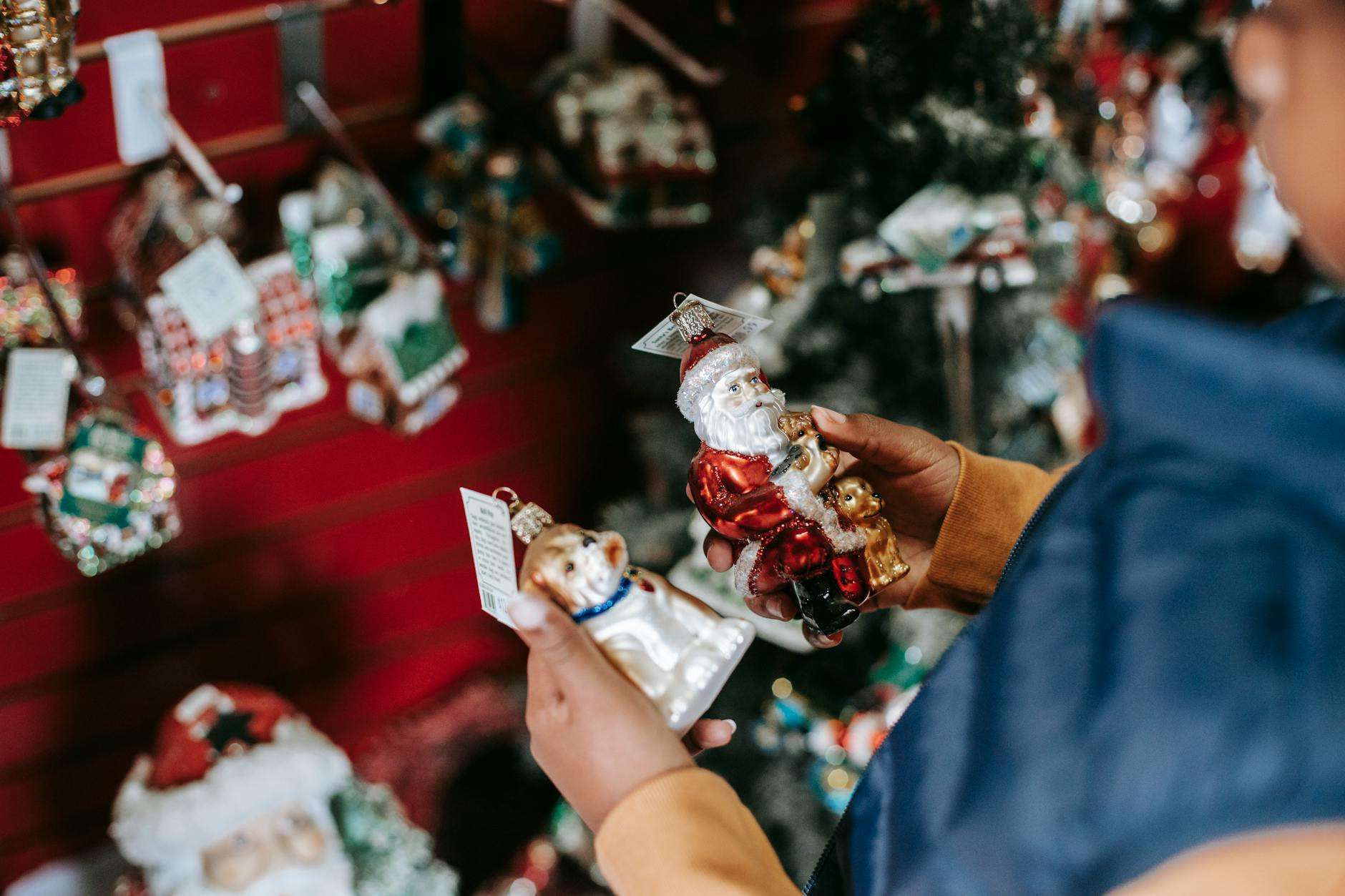 ethnic girl choosing toys for christmas tree