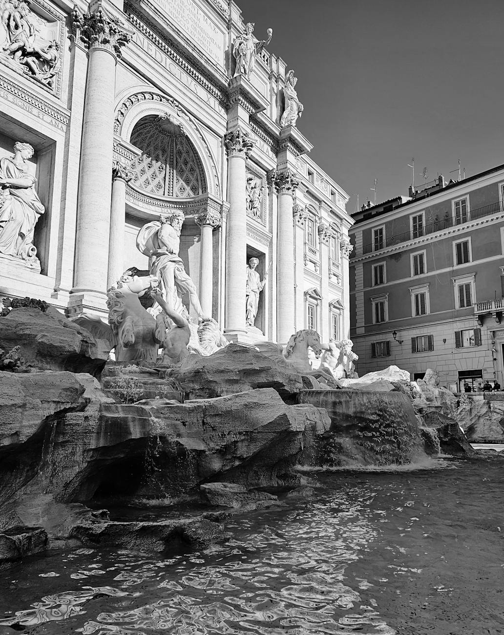 black and white photo of fontanna di trevi in rome italy