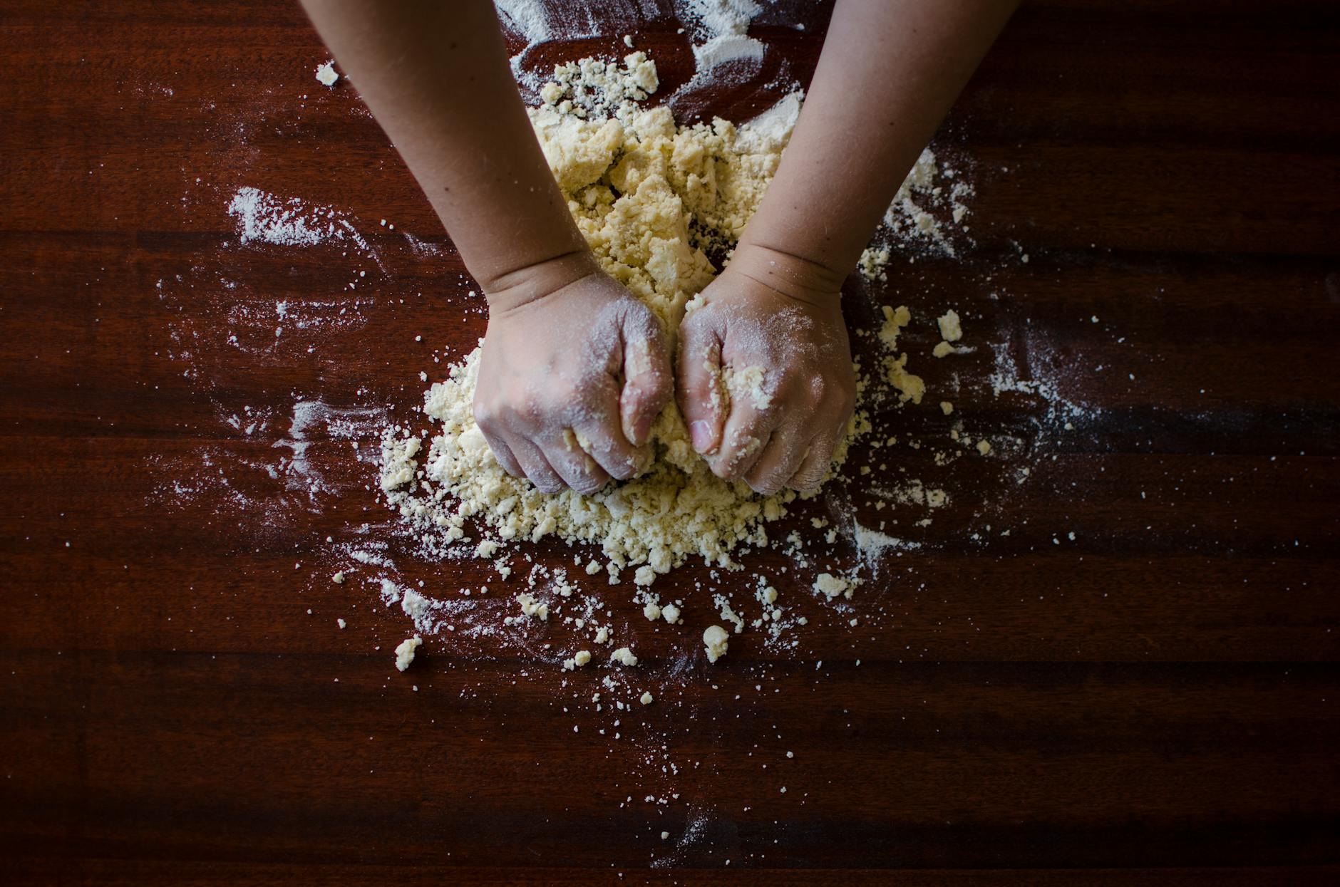 person mixing dough